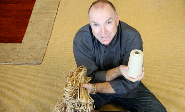 Naturally Advanced CEO, Ken Barker poses with hemp fibres.